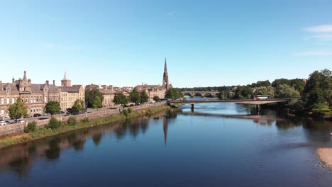 Drone-descending-above-river-Tay-revealing-beautiful-reflection-of-St