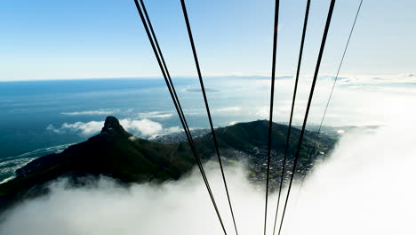 Clouds-moving-in-at-Table-Mountain-aerial-cableway,-view-over-Lion's-Head