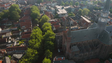Brick-Structure-Of-Gouwekerk-Church-With-Residential-Houses-In-Gouda,-Netherlands