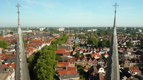 Passing-Over-The-Structure-Tip-Of-Gouwekerk-With-Panoramic-Complex-View-In-Gouda,-Netherlands