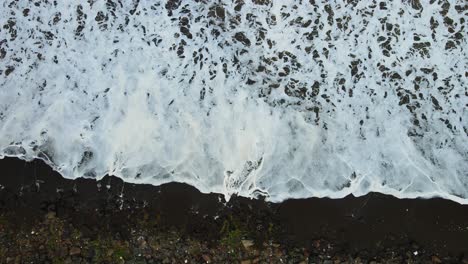 waves-wahing-beach-top-view-exture-black-sand-india-mumbai-movie-lef-drone-shot-