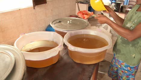 Making-and-filtering-babassu-vegetable-oil-extracted-from-the-seeds-of-the-palm-Attalea-speciosa