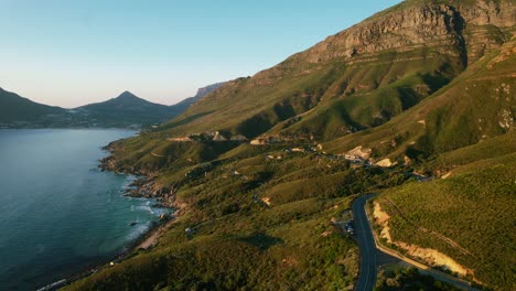 long-twisted-mountain-road-coastline-in-Cape-Town-South-Africa,-aerial
