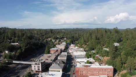 Wide-reverse-pullback-aerial-shot-of-the-historical-mining-town-Placerville