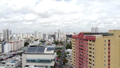 Drone-with-aerial-views-of-the-national-district-of-Santo-Domingo,-flying-over-the-city