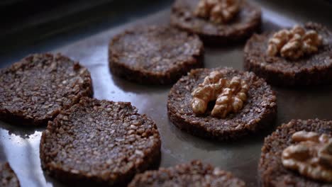 Healthy-Cookies-Made-Of-Bitter-Cocoa-And-Seeds-Top-With-Fresh-Walnuts