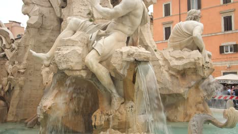 Close-Up-Of-Fountain-of-the-Four-Rivers,-Fontana-dei-Quattro-Fiumi,-In-Piazza-Navona,-Rome,-Italy---tilt-up