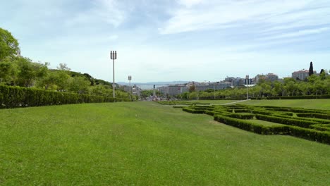 Park-of-Eduardo-VII-offers-views-of-the-complete-length-of-the-MarquÃªs-de-Pombal-and-the-Liberdade-Avenue,-without-ever-losing-sight-of-the-Tejo-River-and-the-ArrÃ¡bida-mountain