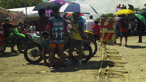 Umbrellas-for-participants-everywhere-as-the-1st-motocross-competition-since-the-pandemic-is-graced-by-unforgiving-heat