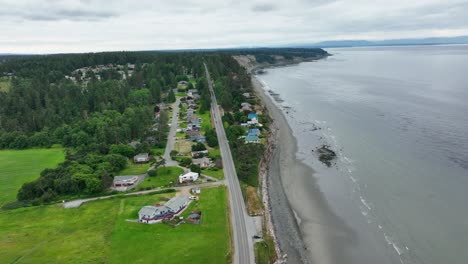 Aerial-view-of-Whidbey-Island's-West-Beach-road-following-the-curve-of-the-coast