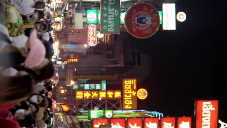 Many-travelers-people-in-Yaowarat-Road-Chinatown,-popular-travel-destination-in-Bangkok,-Thailand