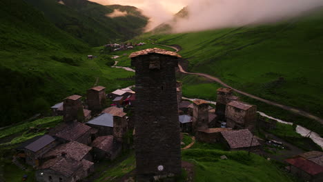 Aerial-View-Of-Ushguli-Community-With-Svan-Towers-and-Castle-At-Sunset-In-Georgia