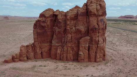 Eroded-Rock-Formation-Cliff-by-Road-in-Southwest-Desert-of-Arizona,-Aerial