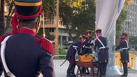 Soldiers-folding-the-Argentine-flag-into-a-box-to-retire-it-for-the-day