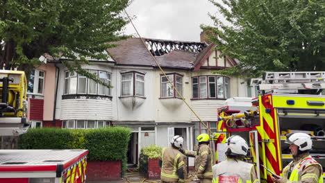 Officers-of-London-Fire-Brigade-attend-the-scene-of-a-house-on-a-residential-road