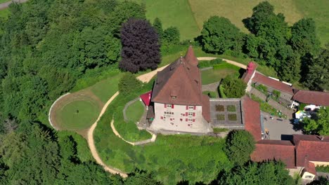 The-small-Liebegg-castle-in-the-canton-of-Aargau-near-GrÃ¤nichen-in-Switzerland-from-the-air-by-drone