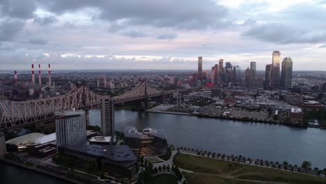 Aerial-view-of-the-Queensboro-Bridge-and-Long-Island-City,-in-New-York,-USA---tracking,-drone-shot