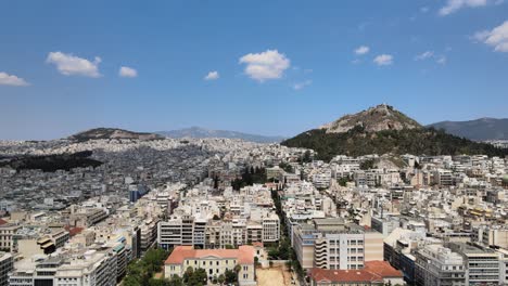 4K-Aerial-drone-view-of-the-city-of-Athens-in-Greece-on-a-sunny-day-going-forward