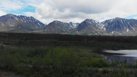 4K-Drone-Video-of-Mountain-Peaks-and-Granite-Creek-near-Denali-National-Park-in-Alaska-on-Sunny-Summer-Day