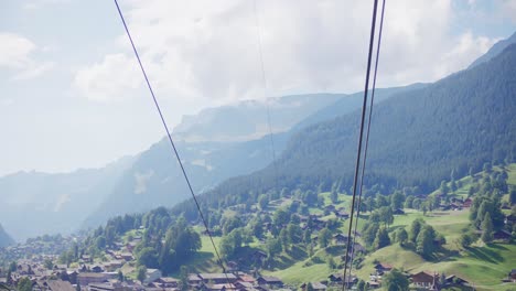 Long-shot,-ski-lift,-Switzerland,-valley,-aerial,-rising,-mountains,-mid-to-high-height