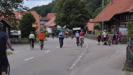 Slow-motion-showing-group-of-bicyclist-riding-on-bike-and-inliner-on-street-of-Solothurn-in-Switzerland-during-slowup-event