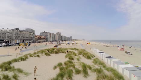 Aerial-View-Of-People-At-Groenendijk-Strand,-Beach-At-Summer-In-Nieuwpoort,-Belgium