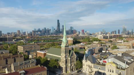 Cinematic-Drone-Shot-Above-Pilsen-Neighborhood-looking-Downtown-Chicago-Skyline-on-Beautiful-Summer-Afternoon