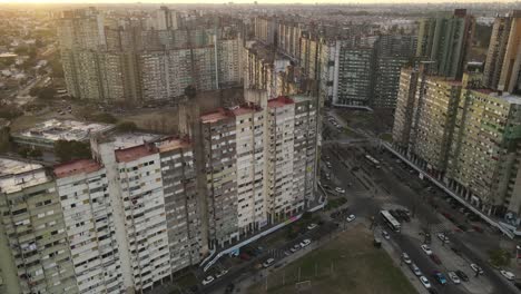 Aerial-drone-view-of-old-skyscraper-and-buildings-in-poor-shanty-district-of-Buenos-Aires-called-Barrio-Gral-or-General-Savio,-Argentina