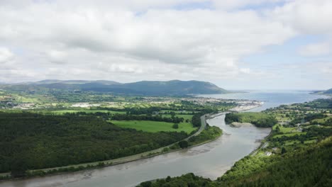 Aerial-Flight-of-the-flagstaff-viewpoint-area,-countryside,-Newry,-with-Warrenpoint-town-in-the-distance-during-the-summer