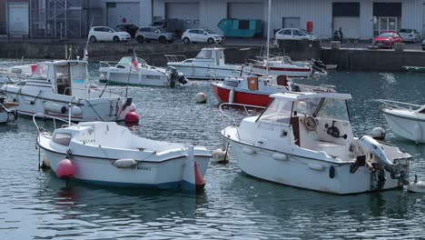 Small-boats-anchored-to-buoys-in-Brest,-France-harbor