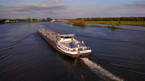 Drone-Flying-Over-Stern-Of-Brandini-Inland-Tanker-Travelling-Along-Oude-Maas