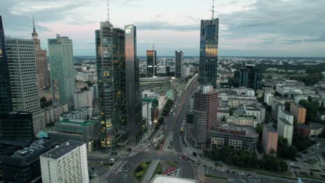 Aerial-view-of-the-bussiness-area-of-Rondo-Onz-with-its-famous-skyscrapers-such-as-the-Palace-of-Culture,-Rondo,-Zlota-and-Varso-Tower