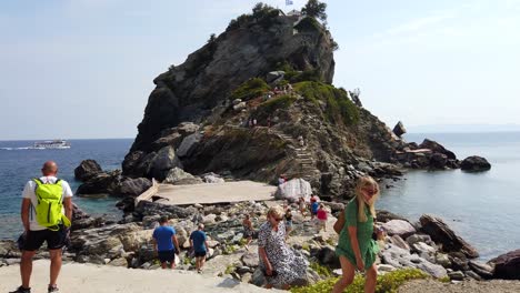 Static-Shot-Of-Tourists-Walking-To-And-Away-From-The-Beautiful-Church-Agios-Ioannis-Kastri-That-Appeared-In-The-Film-Mamma-Mia