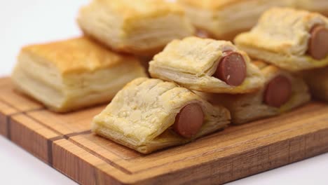 Puff-pastry-with-hot-dog-served-on-the-wooden-board