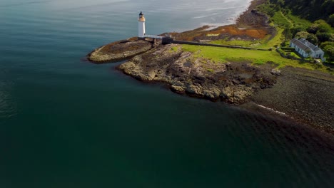 Aerial-drone-shot-of-the-Tobermory-Lighthouse-and-the-beautiful-Isle-of-Mull-Coastline