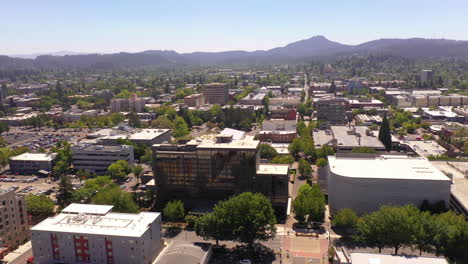Drone-orbit-above-Graduate-Hotel-and-Hult-Center-in-Eugene,-Oregon