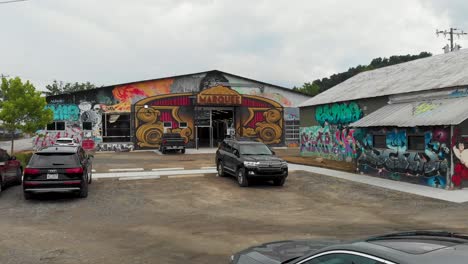 4K-Drone-Video-of-Murals-on-Art-Studios-at-the-River-Arts-District-of-Asheville,-NC