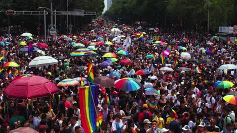 Drone-close-up-low-over-thousands-of-people-at-the-Gay-pride-parade---aerial-view