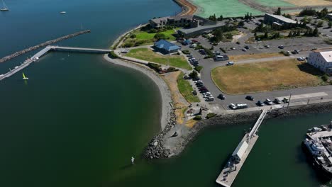 Orbiting-drone-perspective-of-Seafarers-Memorial-Park-on-a-nice-summer-day-in-Anacortes,-Washington
