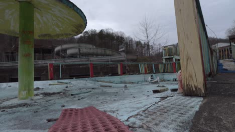 Slider-Footage-of-a-Decaying-Kids-Play-Area-in-an-Abandoned-Rural-Waterpark-in-Eastern-Kentucky