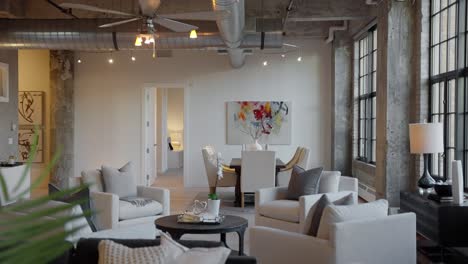 panning-shot-of-a-living-and-dining-space-with-a-rustic-downtown-condo