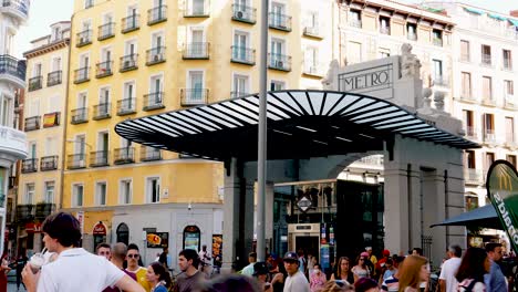 Renovated-Gran-Via-Metro-station-with-crowd-of-people-walking-in-Madrid,-Spain