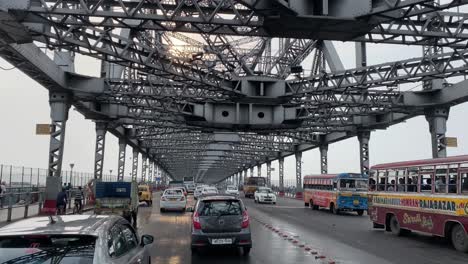 4K-POV-shot-of-driver-driving-along-a-congested-route-of-Howrah-Bridge-Kolkata,-India
