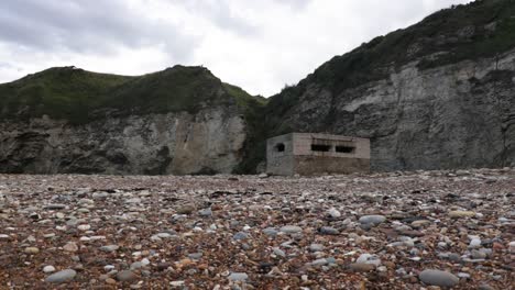 Pillbox-or-guard-post-on-beach-in-England-from-WW2-for-coastal-defence