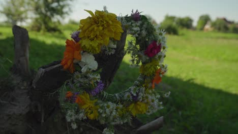 A-wreath-of-flowers-is-hanging-outdoors-in-the-breeze-during-the-summer