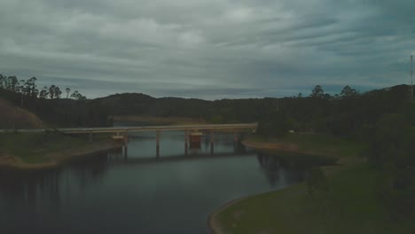 wide-drone-shot-of-bridge-of-tamoios-road-over-paraibuna-reservoir