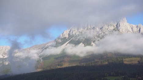 Foggy-morning-in-austrian-alps-with-huge-mountain-in-background,-tyrol