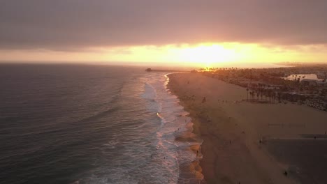 A-flight-over-a-Southern-California-Beach-at-sunset