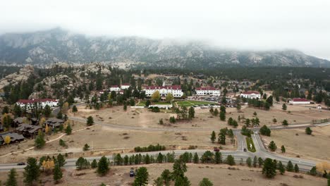 Aerial-view-moves-in-on-Stanley-Hotel-in-Estes-Park-Colorado-on-cloudy-Fall-day