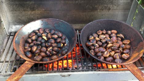 Chestnuts-roasted-on-open-fire,-seasonal-delicacy,-harvest,-4k-UHD,-crane-shot
